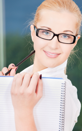 bright picture of lovely businesswoman in officeの写真素材