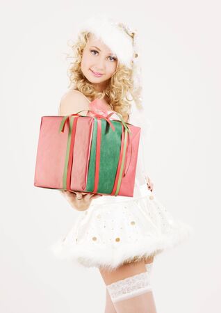 picture of cheerful santa helper girl with gift boxの写真素材
