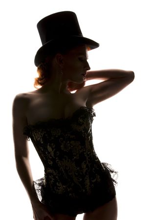 silhouette backlight picture of sexy woman in corsetの写真素材