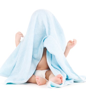 picture of baby boy with blue towel over whiteの写真素材