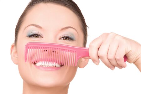 bright picture of beautiful woman with combの写真素材
