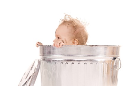 picture of adorable baby in trash canの写真素材