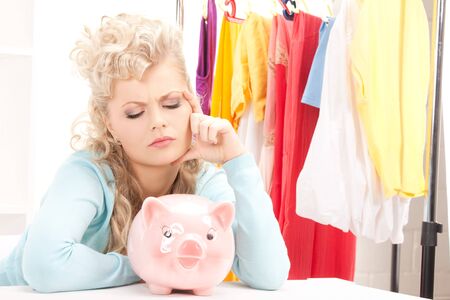 picture of lovely woman with piggy bank