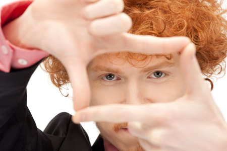 picture of handsome man creating a frame with fingersの写真素材