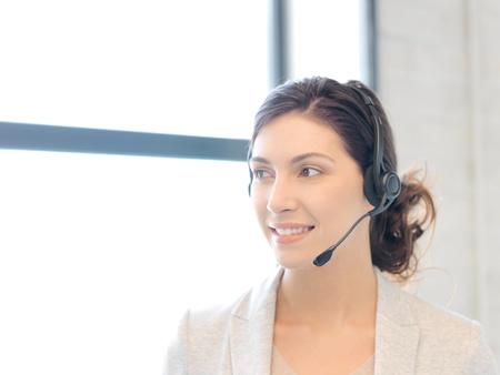 bright picture of friendly female helpline operatorの写真素材