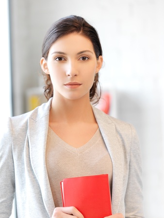 picture of calm and serious woman with bookの写真素材