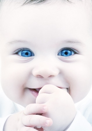 closeup portrait of adorable baby with blue eyesの写真素材