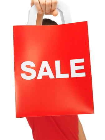 closeup picture of man s hands holding shopping bagの写真素材