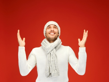 picture of handsome man in warm sweater, hat and scarf の写真素材