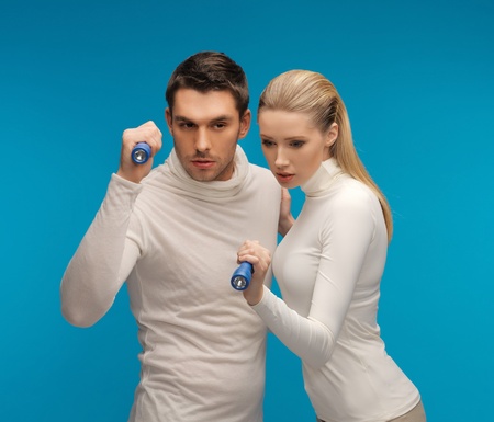 picture of  man and woman with pocket flashlightsの写真素材