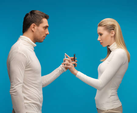 picture of man and woman with modern gadgets