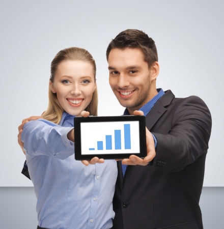 bright picture of man and woman with tablet pcの写真素材