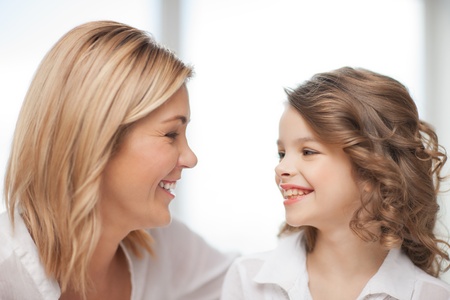 bright closeup picture of mother and daughterの写真素材