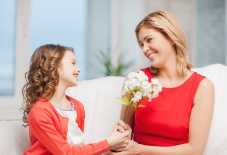 picture of mother and daughter with flowersの写真素材