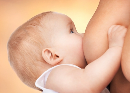 picture of calm mother feeding adorable babyの写真素材