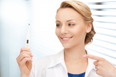 picture of attractive female doctor with thermometerの写真素材