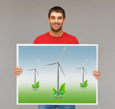 handsome man with picture of wind turbines