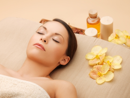 picture of woman in spa salon lying on the massage deskの写真素材