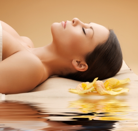 picture of woman in spa salon lying on the massage deskの写真素材