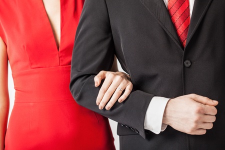 couple with wedding ring holding each other handsの写真素材