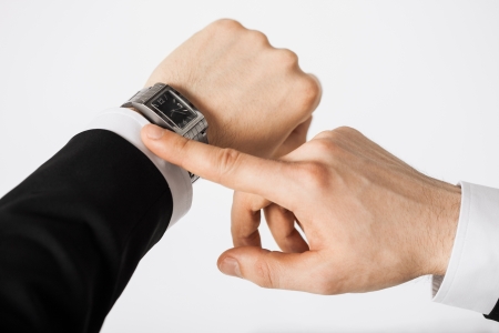 close up of man looking at wristwatchの写真素材