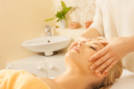 close up of woman in spa salon getting face treatmentの写真素材