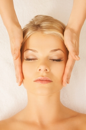 close up of woman in spa salon getting face treatmentの写真素材