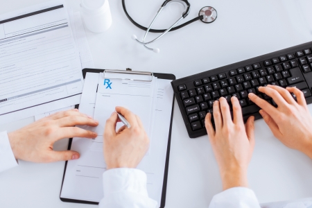 picture of doctor and nurse writing prescription paperの写真素材