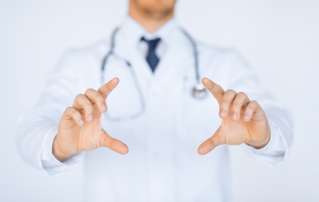 close up of doctor with holding something with handsの写真素材