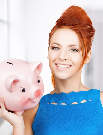 picture of lovely woman with big piggy bankの写真素材