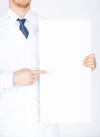 close up of doctor holding blank white bannerの写真素材