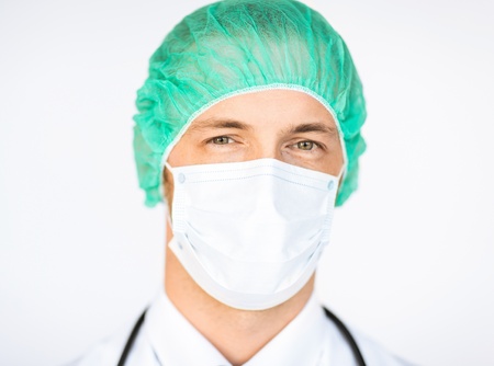picture of half face of surgeon in medical cap and maskの写真素材