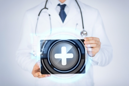 close up of male doctor holding tablet pc with medical appの写真素材