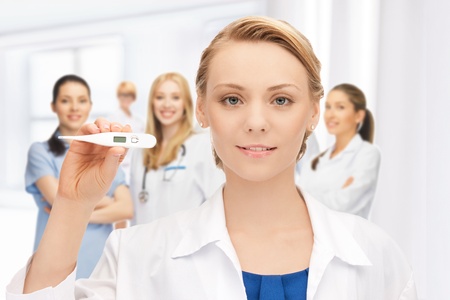 picture of attractive female doctor with thermometerの写真素材