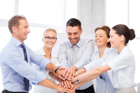 picture of happy business team celebrating victory in officeの写真素材