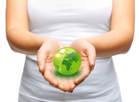 environment and technology concept - woman hands holding green sphere globeの写真素材