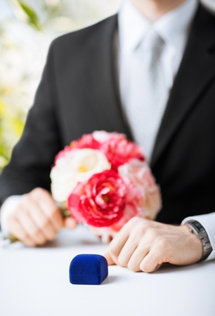 picture of man with gift box in suitの写真素材