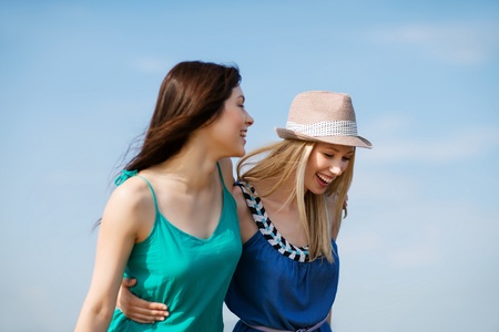 girls walking summer holidays and vacation の写真素材