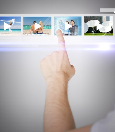technology, internet and networking concept - man pressing button on virtual screenの写真素材