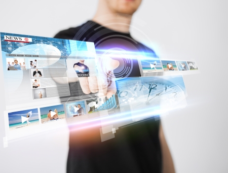 business, technology, internet and networking concept - man pressing button on virtual screenの写真素材