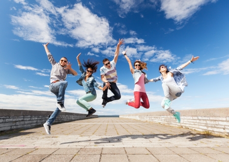 summer, sport, dancing and teenage lifestyle concept - group of teenagers jumping summer, sport, dancing and teenage lifestyle concept - group of teenagers jumping