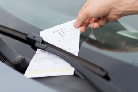 transportation and vehicle concept - parking ticket on car windscreen transportation and vehicle concept - parking ticket on car windscreen