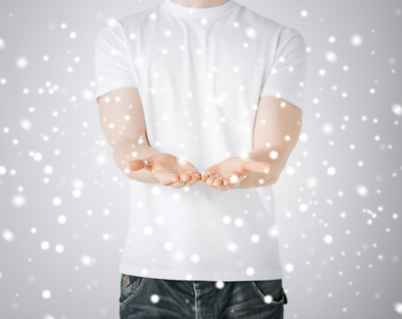 close up of mans hands showing somethingの写真素材