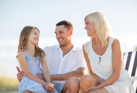 summer holidays, children and people concept - happy family having a picnicの写真素材