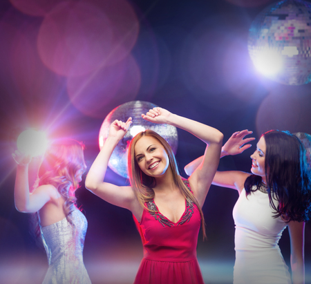 party, celebration, friends, bachelorette party, birthday concept - three beautiful women in evening...