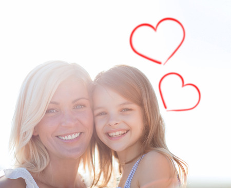 summer holidays, family, children and people concept - happy mother and child girlの写真素材