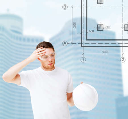 building, developing, consrtuction and architecture concept - male architect in safety glasses...