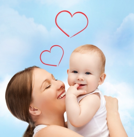 family, children, parenthood and happiness concept - happy mother with adorable babyの写真素材