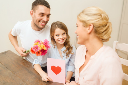 holidays, family, hapiness and people concept - happy family celebrating mothers dayの写真素材