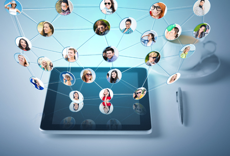 social networking, communication and technology concept - tablet pc with cup of coffeeの写真素材